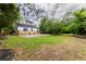 Spacious backyard featuring a new wooden deck and a mix of lush green grass and landscaping at 2736 Joyce Ave, Decatur, GA 30032