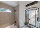Stylish bathroom featuring tiled shower, modern vanity with plant, and updated fixtures at 2736 Joyce Ave, Decatur, GA 30032