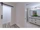 Bathroom with dual vanity, marble floors, and walk-in shower at 2736 Joyce Ave, Decatur, GA 30032