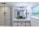 Bathroom featuring a modern vanity, glass enclosed shower, and sleek fixtures at 2736 Joyce Ave, Decatur, GA 30032