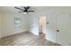 Bedroom with luxury vinyl plank flooring, modern ceiling fan, window, closet, and fresh paint at 2736 Joyce Ave, Decatur, GA 30032