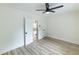 Bedroom with luxury vinyl plank flooring, modern ceiling fan, closet, and fresh paint at 2736 Joyce Ave, Decatur, GA 30032