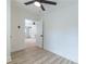 Bright bedroom featuring modern flooring, a ceiling fan and ample natural light at 2736 Joyce Ave, Decatur, GA 30032