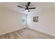 Bedroom with luxury vinyl plank flooring, modern ceiling fan, window, and fresh paint at 2736 Joyce Ave, Decatur, GA 30032