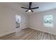 Bedroom featuring ceiling fan, window, and ensuite bathroom at 2736 Joyce Ave, Decatur, GA 30032