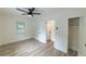 Bedroom with luxury vinyl plank flooring, window, closet, and fresh paint at 2736 Joyce Ave, Decatur, GA 30032