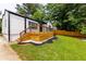 Charming home exterior highlighting the wooden deck, perfect for outdoor living at 2736 Joyce Ave, Decatur, GA 30032