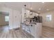 Modern kitchen featuring an island with a marble countertop and contemporary pendant lighting at 2736 Joyce Ave, Decatur, GA 30032