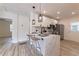 Beautiful kitchen featuring an eat-in island with modern fixtures, cabinets, and stainless appliances at 2736 Joyce Ave, Decatur, GA 30032