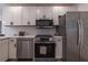 Modern kitchen with stainless steel appliances and sleek white cabinets, great for cooking at 2736 Joyce Ave, Decatur, GA 30032