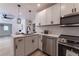 This modern kitchen features a stylish island, stainless steel appliances, and sleek lighting at 2736 Joyce Ave, Decatur, GA 30032