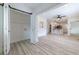 Open living space with a barn door to storage and views into the modern eat-in kitchen at 2736 Joyce Ave, Decatur, GA 30032