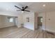 Bright living room with hardwood floors, ceiling fan, and neutral walls at 2736 Joyce Ave, Decatur, GA 30032