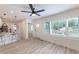 An open-concept living area with sleek floors, plenty of natural light, and ceiling fan at 2736 Joyce Ave, Decatur, GA 30032