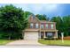 Inviting two-story home with brown siding, shutters, a well-manicured lawn and a two car garage at 60 Copeland Trce, Dallas, GA 30157