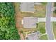 Aerial view of home showcasing its backyard, patio, and position within a well-maintained neighborhood at 607 Little Shoals Ct, Canton, GA 30115