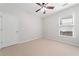 Neutral bedroom with carpet, window, and white door at 607 Little Shoals Ct, Canton, GA 30115