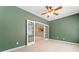 Green-walled room with carpet and French doors leading to another room at 607 Little Shoals Ct, Canton, GA 30115