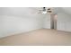 Spacious bonus room featuring vaulted ceiling, neutral carpet, ceiling fan, and natural light, ready for any living space needs at 607 Little Shoals Ct, Canton, GA 30115