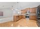 Modern kitchen featuring stainless steel appliances and hardwood floors at 607 Little Shoals Ct, Canton, GA 30115