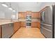 Updated kitchen featuring stainless steel appliances and hardwood floors at 607 Little Shoals Ct, Canton, GA 30115
