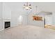 Spacious living room featuring a fireplace and open access to kitchen at 607 Little Shoals Ct, Canton, GA 30115