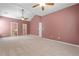 Large main bedroom with ceiling fans, plush carpet, and access to bathroom and closet at 607 Little Shoals Ct, Canton, GA 30115