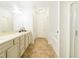 Hall bathroom with long vanity, tile flooring, and combined tub/shower at , Dallas, GA 30157