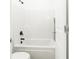 Bright bathroom with a white tub and shower featuring modern black fixtures at , Dallas, GA 30157
