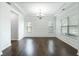 Bright dining room boasts hardwood floors, elegant trim, and a modern chandelier at , Dallas, GA 30157