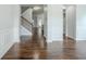 Hallway featuring hardwood floors and molding on walls and an adjacent stairwell at , Dallas, GA 30157