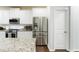 Bright kitchen featuring stainless steel appliances, granite countertops, and white cabinetry at , Dallas, GA 30157