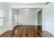 Spacious living room featuring hardwood floors, crown molding, and abundant natural light at , Dallas, GA 30157