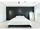 Stylish main bedroom features a dark accent wall, tray ceiling, and plush carpet at , Dallas, GA 30157