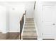 Staircase with carpet steps and wood banister at , Dallas, GA 30157