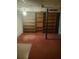 Spacious basement featuring built-in wooden shelving for storage and organization at 204 Melanie Ln, Woodstock, GA 30188