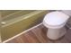 Bathroom features a toilet, bathtub, and modern wood-look flooring at 204 Melanie Ln, Woodstock, GA 30188
