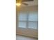 Bright bedroom features windows with blinds, carpeted floors, and a ceiling fan at 204 Melanie Ln, Woodstock, GA 30188