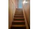 Carpeted stairs with wooden handrail at 204 Melanie Ln, Woodstock, GA 30188