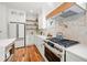 Well-equipped kitchen featuring white cabinets, a modern oven range, and stainless steel appliances at 224 Cambridge Ave, Decatur, GA 30030