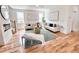 Stylish living room with hardwood floors, neutral decor, fireplace and ample seating at 224 Cambridge Ave, Decatur, GA 30030