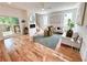 Sun-filled living room featuring hardwood floors, fireplace, and access to the outdoor deck at 224 Cambridge Ave, Decatur, GA 30030