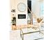 Stylish living room featuring a modern fireplace and staircase at 224 Cambridge Ave, Decatur, GA 30030