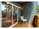 Cozy patio offering a view of the backyard from a large sliding glass door and a place to sit and relax at 224 Cambridge Ave, Decatur, GA 30030