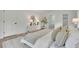 Bright main bedroom with ensuite bathroom featuring a dresser, lamps, and an area rug at 3512 Hidden Acres Dr, Atlanta, GA 30340