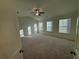 Spacious bedroom features a ceiling fan and three large windows for plenty of natural light at 7695 Baron Rd, Fairburn, GA 30213