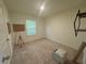 Neutral bedroom with a window and potential for various uses such as an office space at 7695 Baron Rd, Fairburn, GA 30213