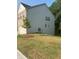 This home has siding and a brick front with a well manicured lawn at 7695 Baron Rd, Fairburn, GA 30213