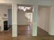 Spacious living room featuring hardwood floors, a fireplace, and abundant natural light at 7695 Baron Rd, Fairburn, GA 30213
