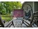 Cozy backyard patio with hammock, seating, and landscaped yard at 842 Third St, Stone Mountain, GA 30083